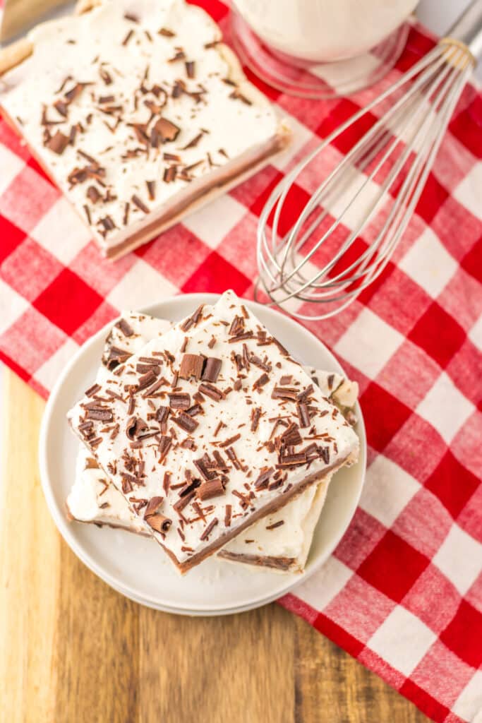 Overhead shot of sheet pan French silk pie slice with red checkered napkin