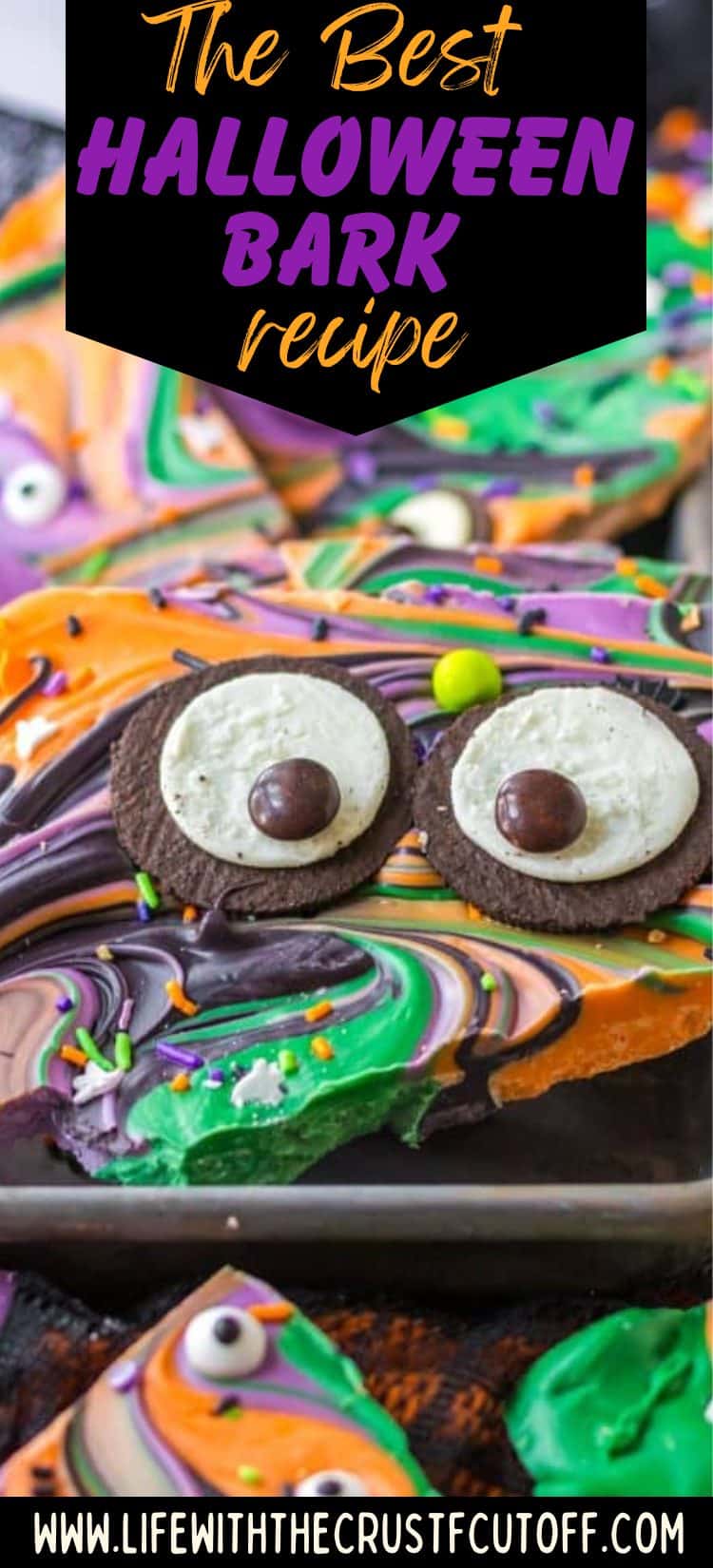 Colorful chocolate Halloween bark topped with candy eyes and sprinkles