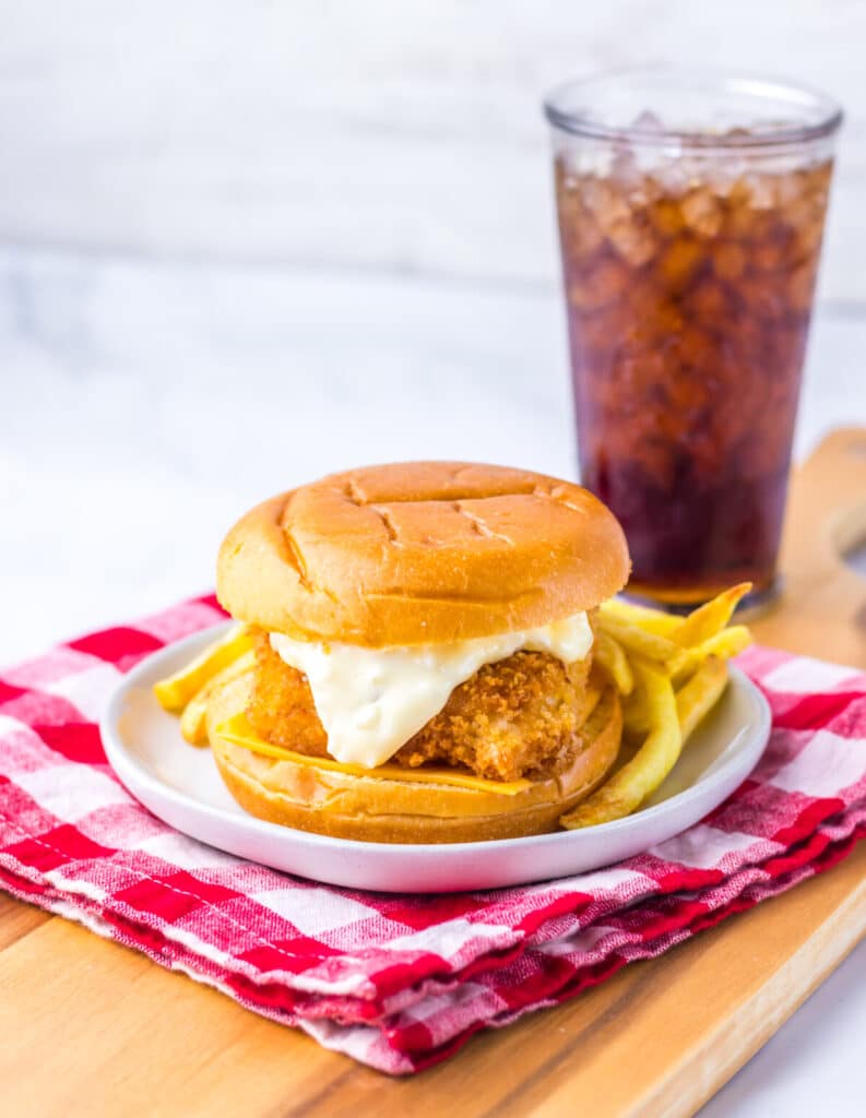 Close-up of crispy Filet-O-Fish sandwich with tartar sauce and melted cheese.