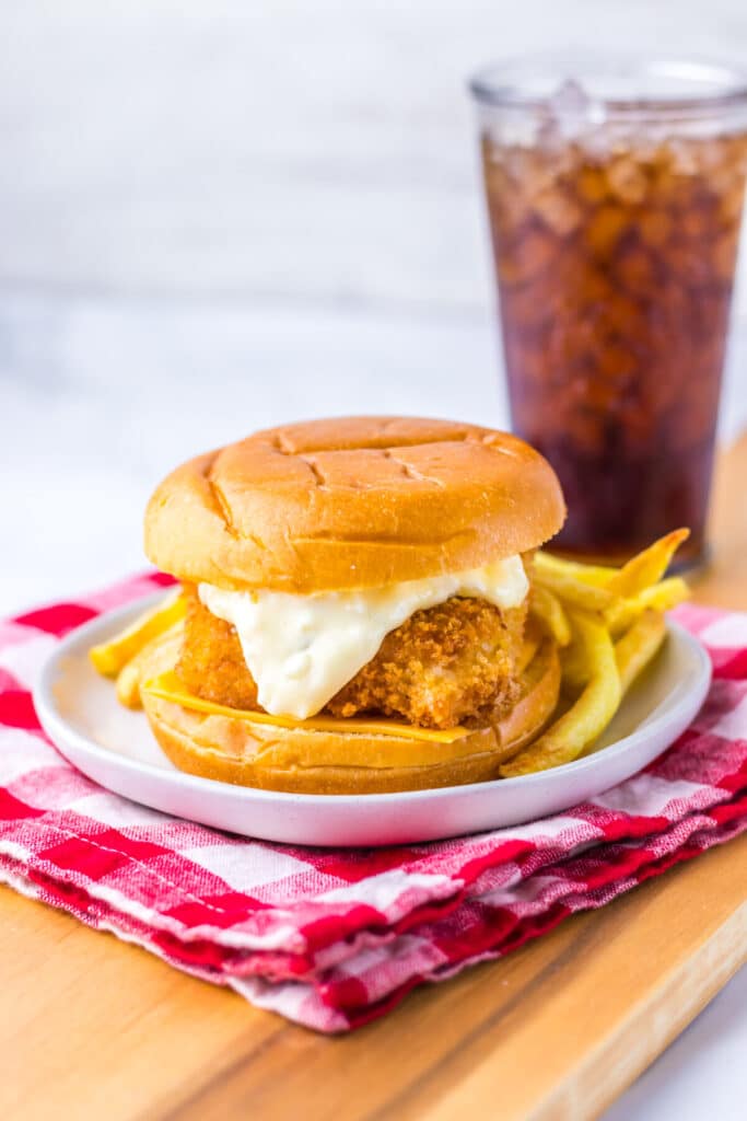 Close-up of crispy Filet-O-Fish sandwich with tartar sauce and melted cheese.