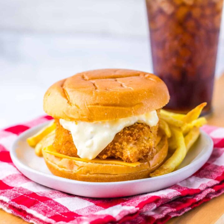 Close-up of crispy Filet-O-Fish sandwich with tartar sauce and melted cheese.