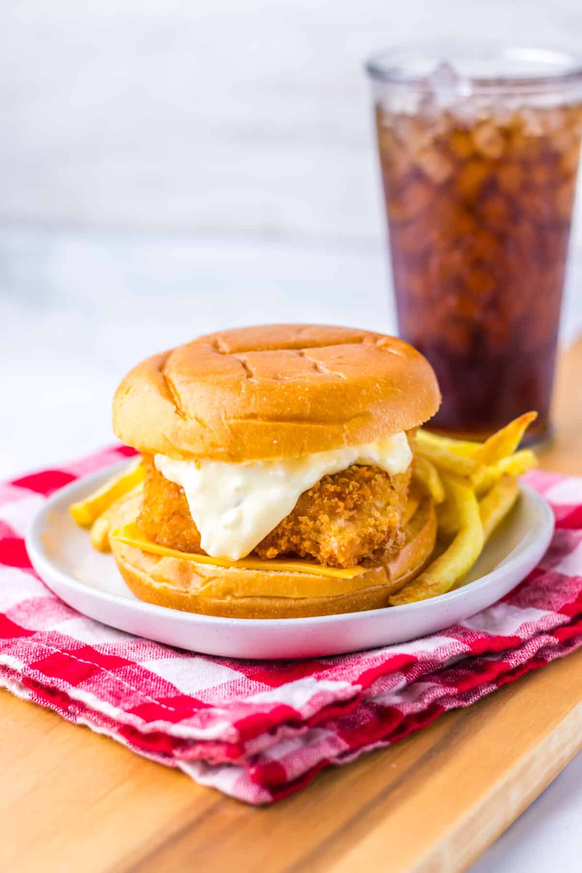Close-up of crispy Filet-O-Fish sandwich with tartar sauce and melted cheese.
