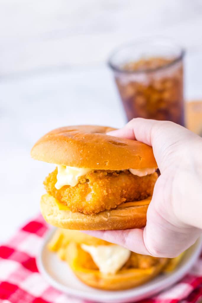 Close-up of crispy Filet-O-Fish sandwich with tartar sauce and melted cheese.