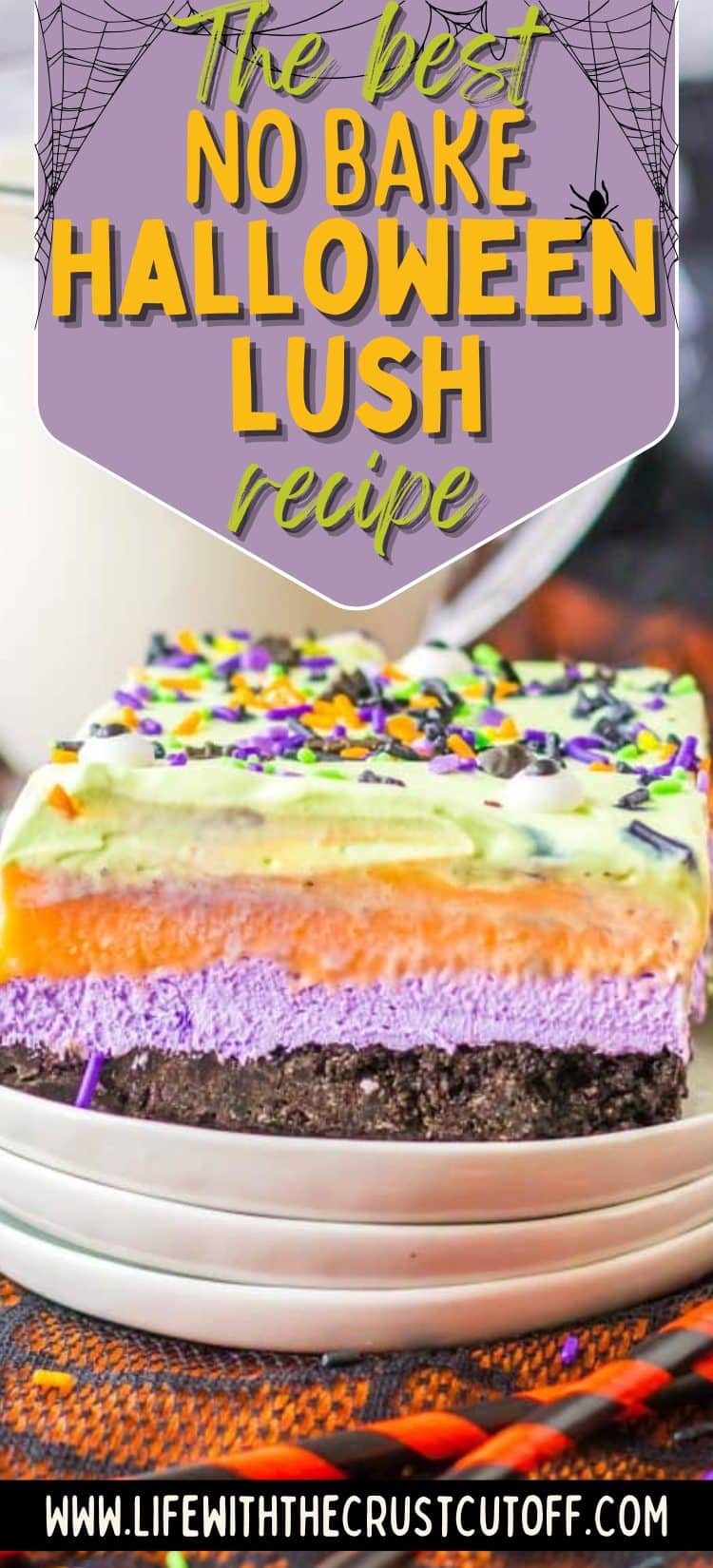 Layered Halloween lush dessert topped with sprinkles and candy eyes.