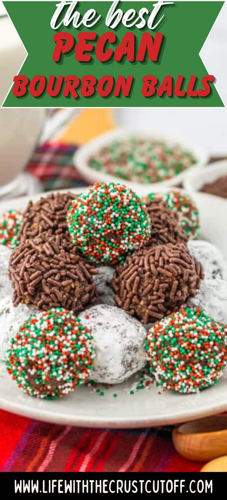 Pecan bourbon balls dusted with powdered sugar on a holiday serving plate.