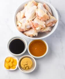 Overhead view of chicken wings and sauce ingredients