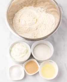 Bowl of flour, yeast, and salt combined for bread dough.