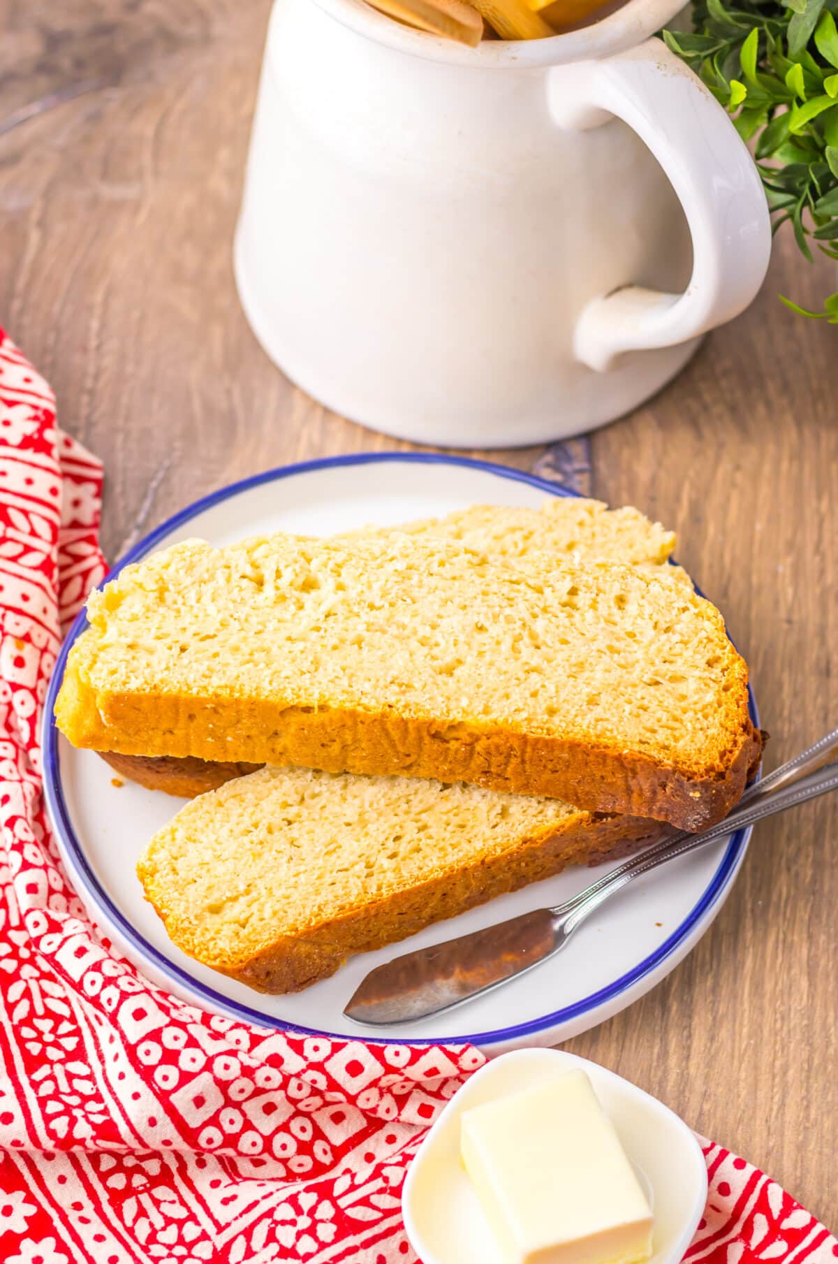 Slow cooker sourdough-style bread sliced to show soft, airy texture.