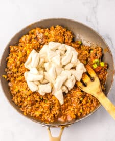 Taco Bubble Up Bake in pan with spoon