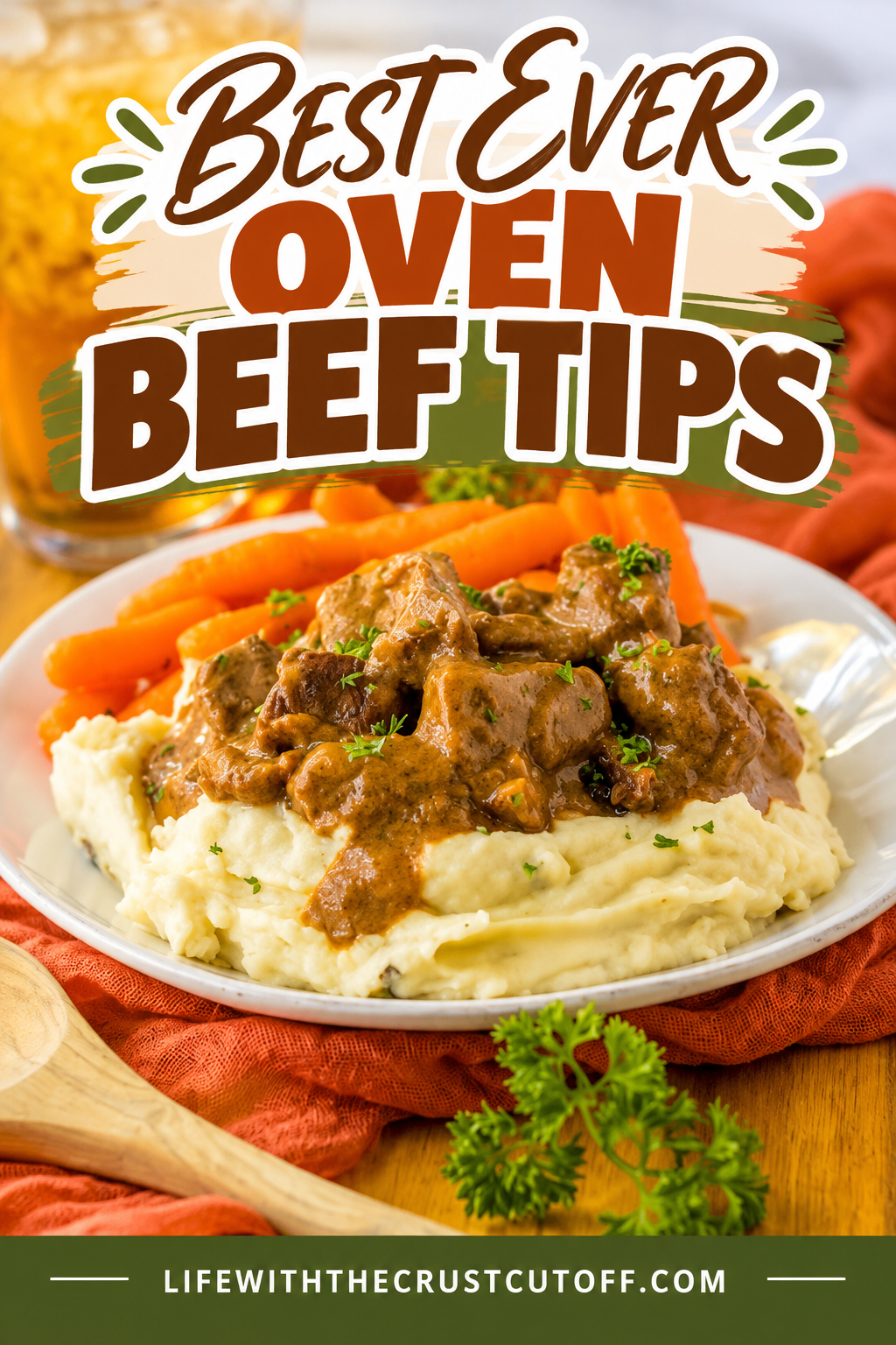Tender oven beef tips and gravy served over creamy mashed potatoes with carrots on the side.