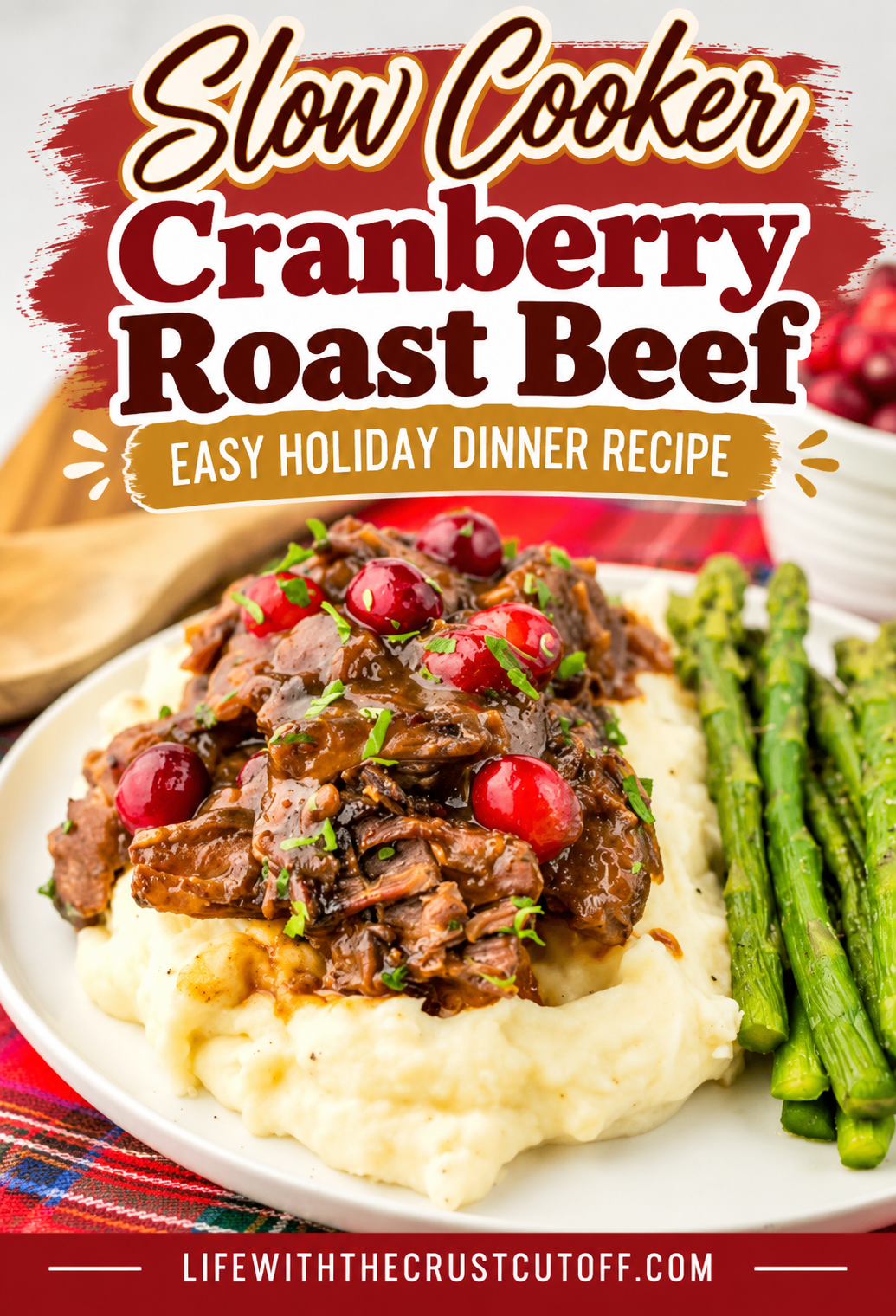 Slow Cooker Cranberry Roast Beef with cranberry sauce served over creamy mashed potatoes with asparagus.