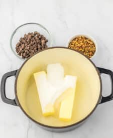 Process shot showing melted butter and sugar mixture bubbling in a saucepan to make English toffee
