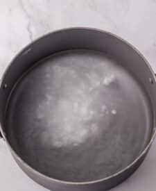 Boiling water with baking soda added for pretzel bath step.