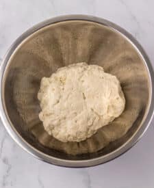 Pretzel dough in a mixing bowl before rising.