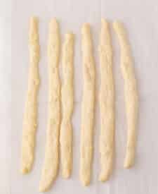 Pretzel dough rolled out and ready to wrap around hot dogs