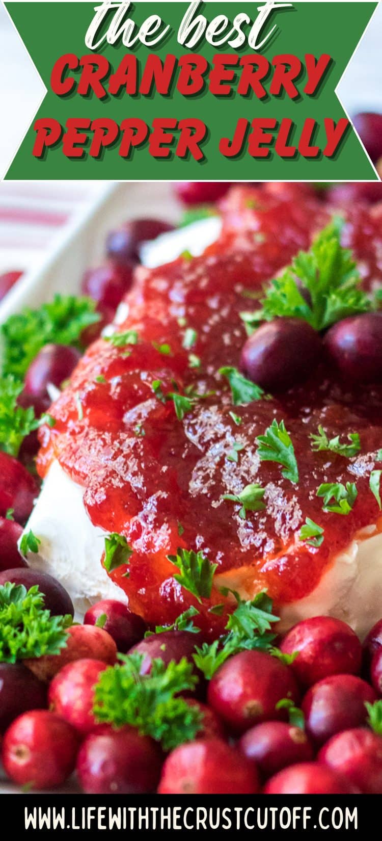 Cranberry pepper jelly dip served over cream cheese with crackers on the side.