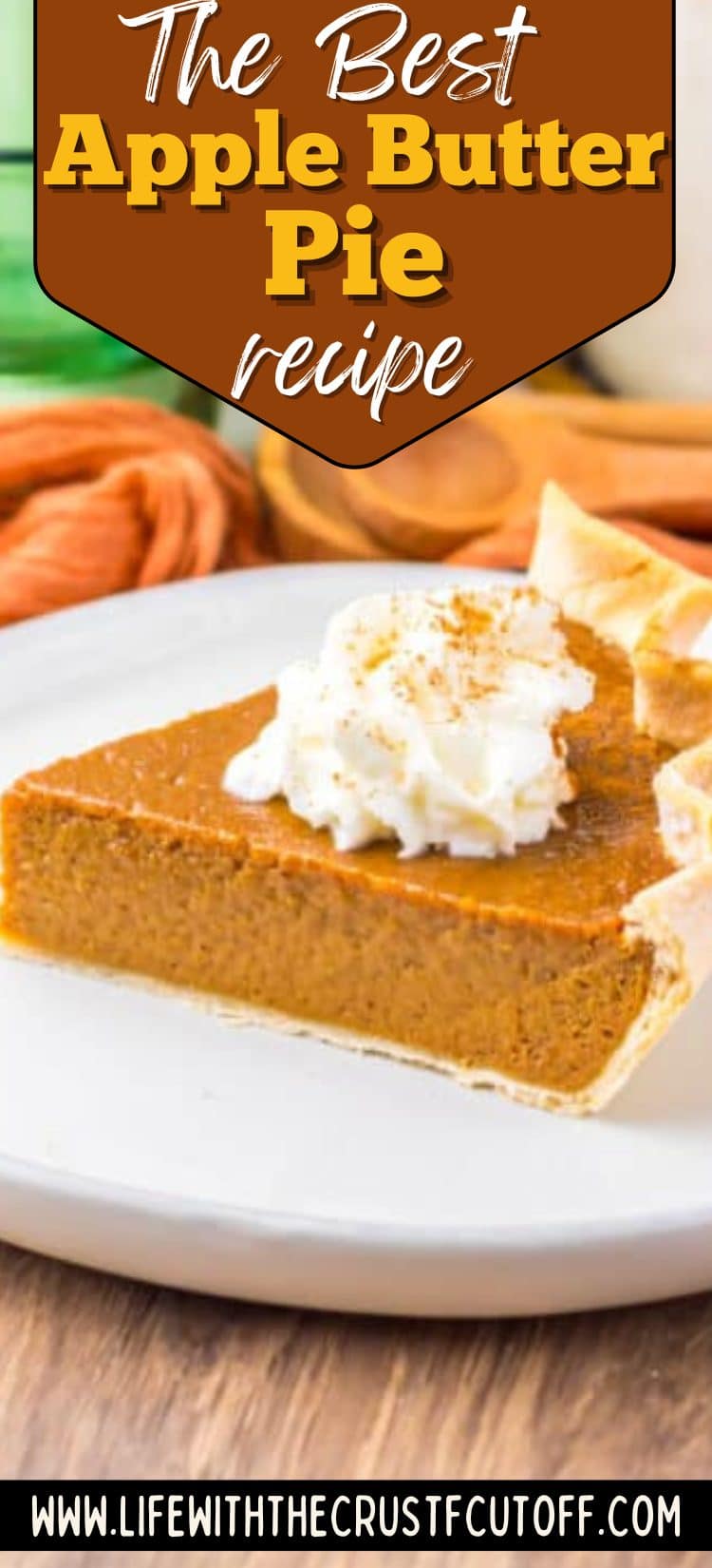 Slice of apple butter pie with whipped cream on top and a flaky crust.