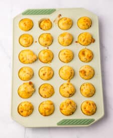 Golden baked McGriddle bites cooling in silicone mini muffin pan
