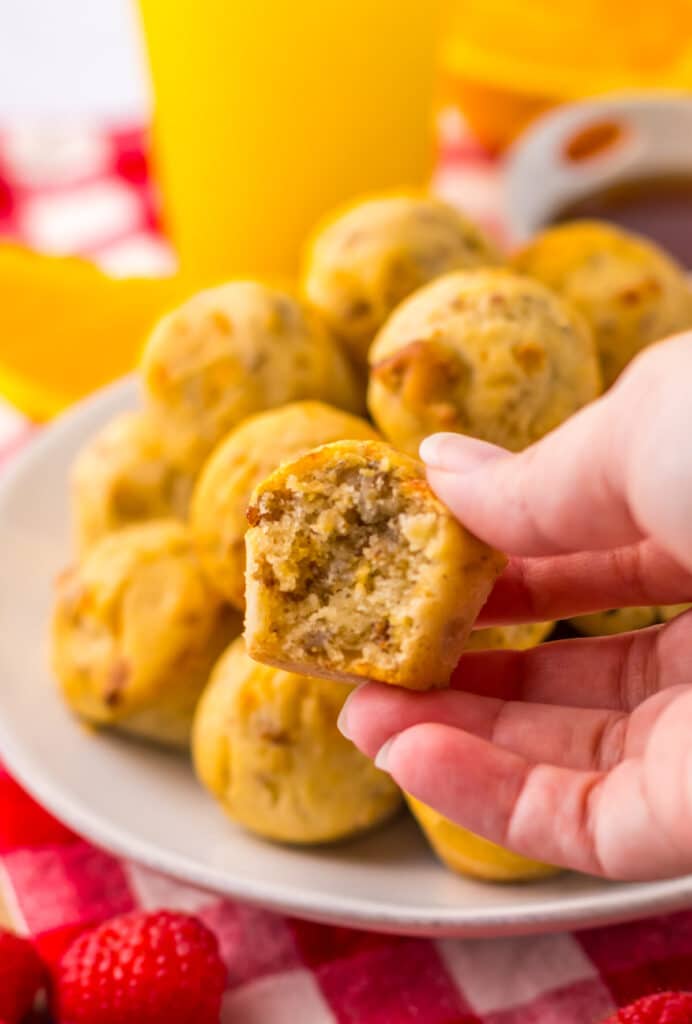 Close-up hand holding a McGriddle bite showing fluffy inside