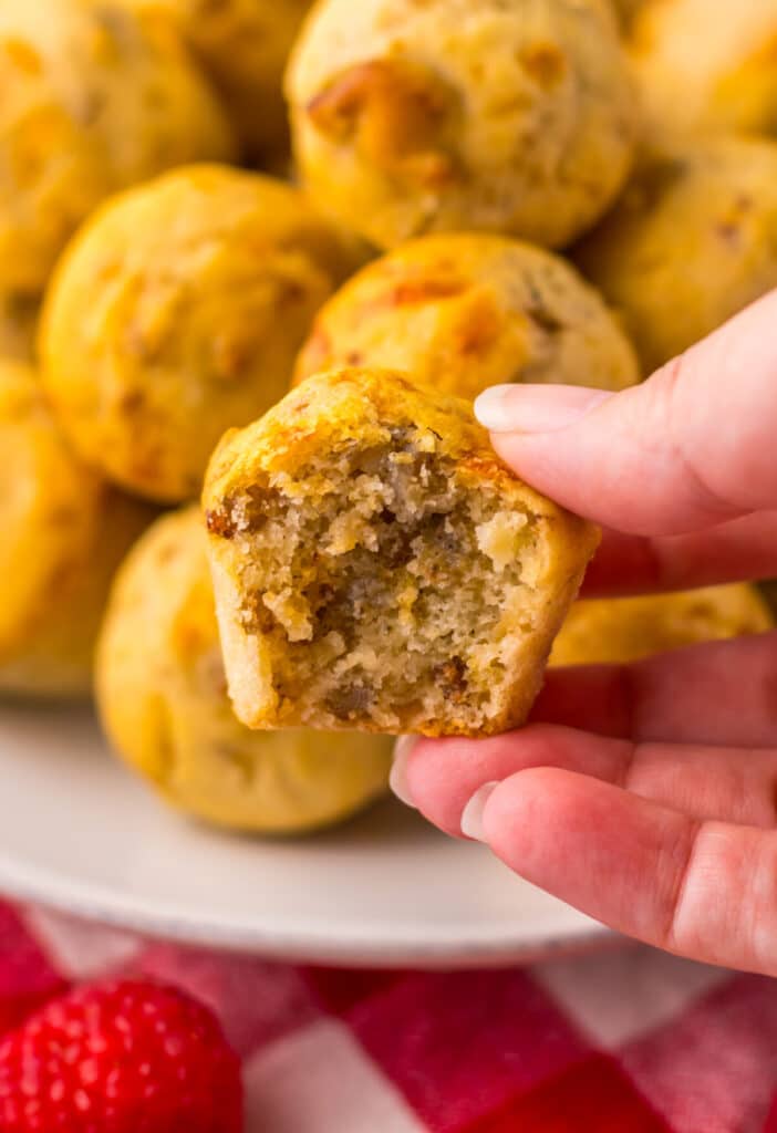Close-up hand holding a McGriddle bite showing fluffy inside