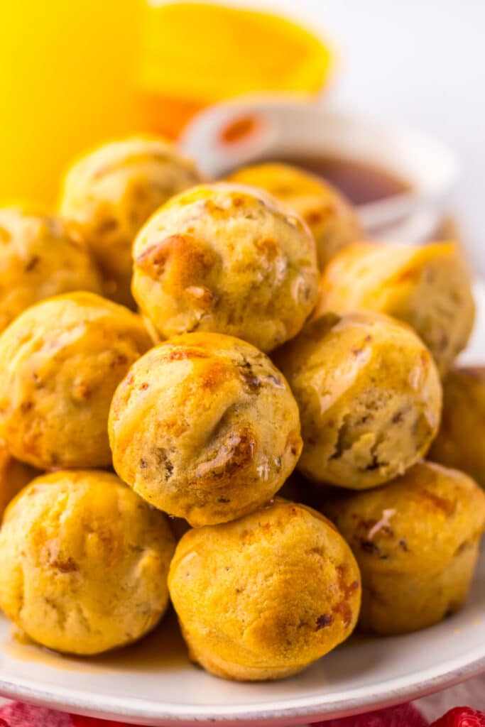 Warm McGriddle bites stacked for serving with syrup drizzle