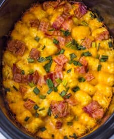 Golden, bubbly slow cooker chicken bacon ranch tater tot casserole after cooking.