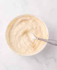 Bowl of homemade yogurt sauce with spoon
