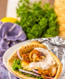Slow Cooker Chicken Shawarma in pita with lettuce, tomato, and yogurt sauce