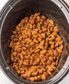 Almonds in slow cooker before cooking.