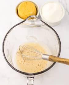 Egg white mixture in mixing bowl with whisk.