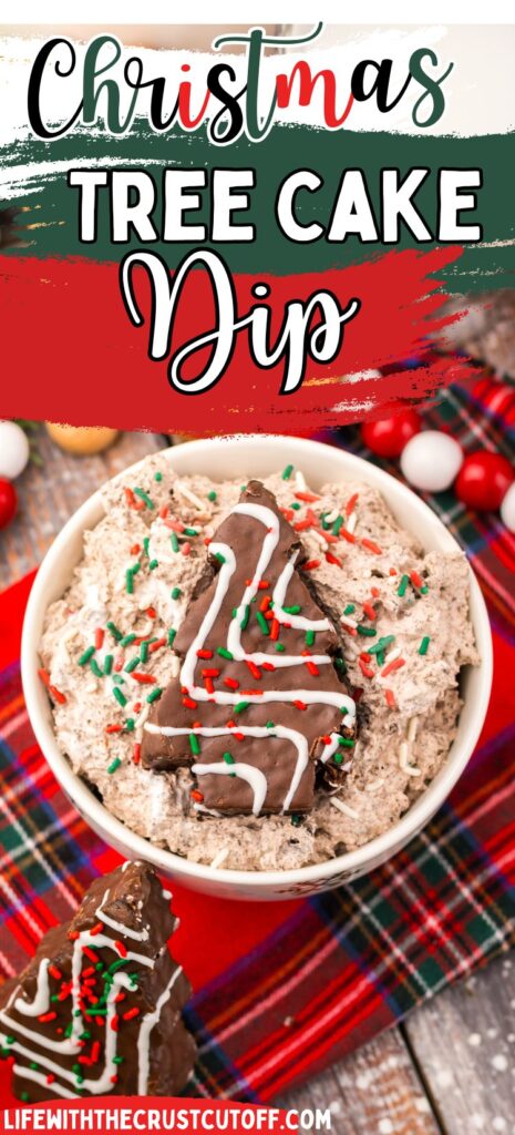 Chocolate Christmas tree cake dip topped with crushed cakes, whipped cream, and holiday sprinkles.