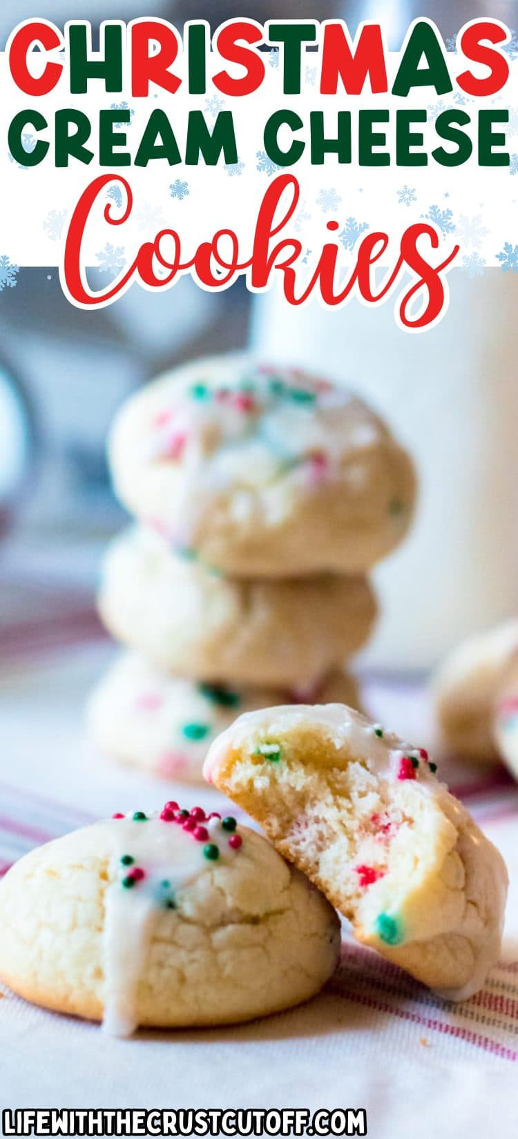 Soft Christmas cream cheese cookies topped with red and green sprinkles on a white plate