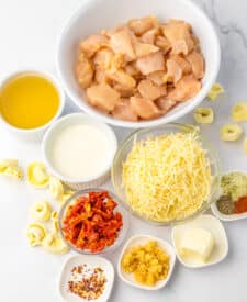 Ingredients for marry me chicken tortellini laid out on a countertop
