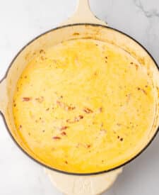 Creamy sauce simmering with chicken for marry me chicken recipe