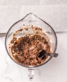Brownie bomb mixture being stirred in a mixing bowl.