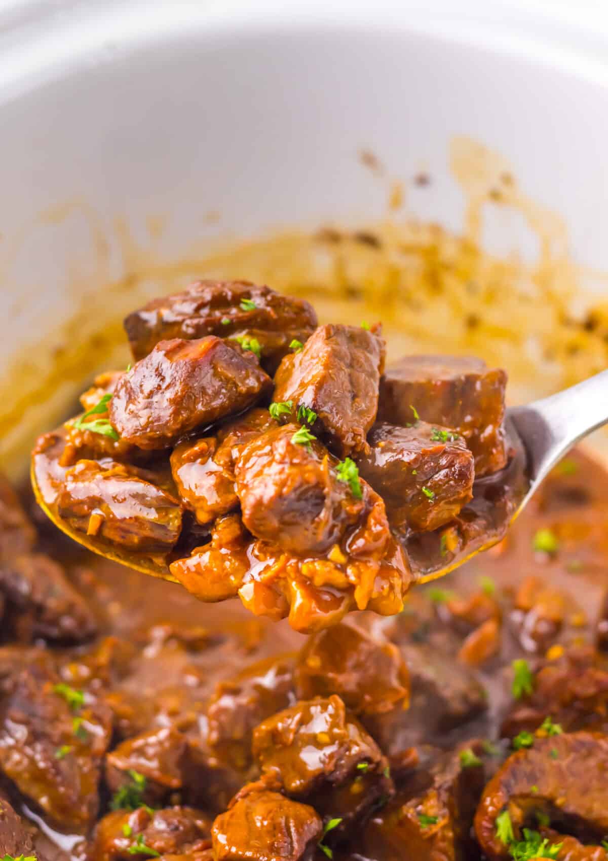 Steak bites tossed in thick Dr Pepper glaze just before serving.