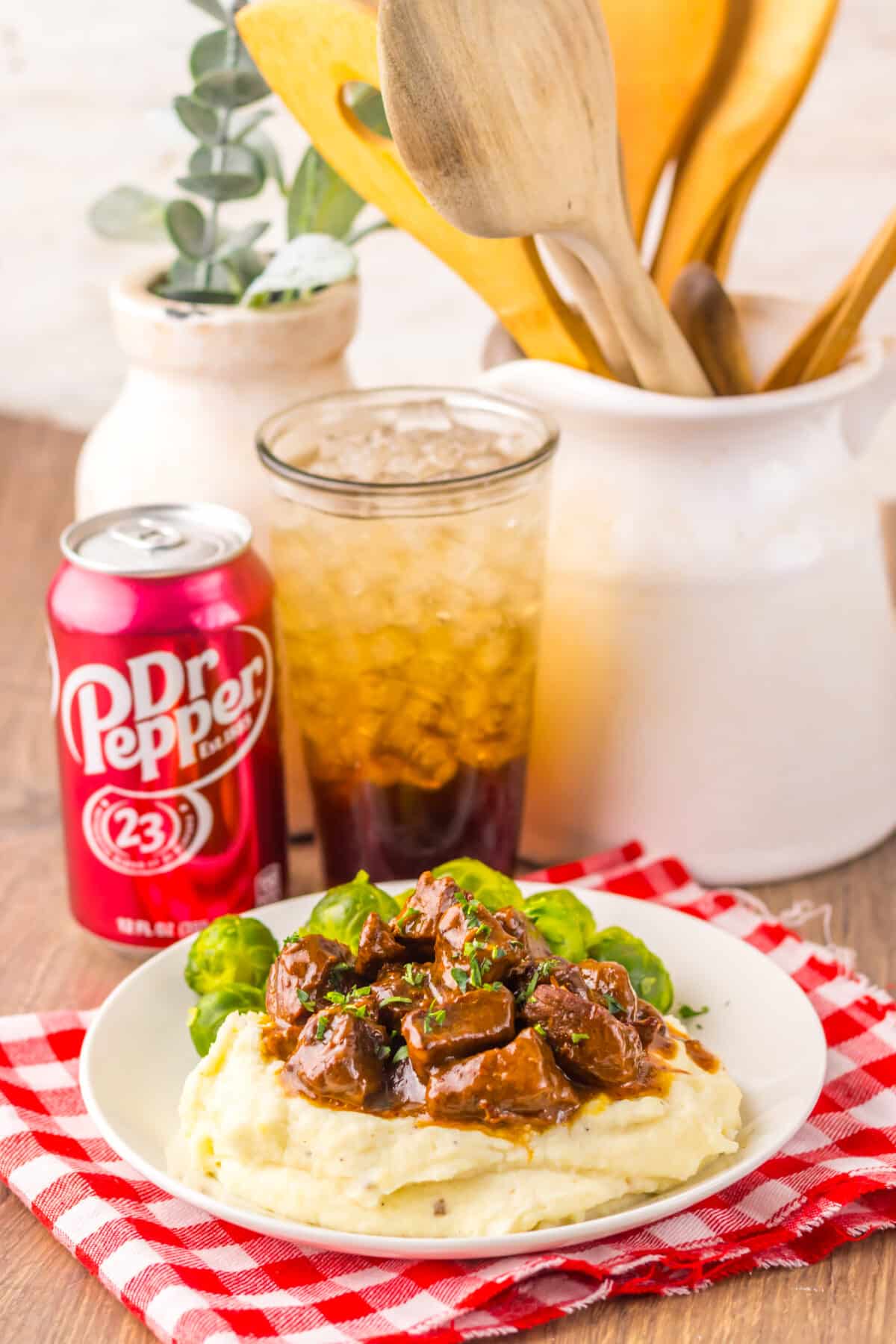 Dr Pepper steak bites plated and garnished with herbs.