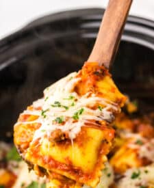 Close-up of layered ravioli lasagna with meat sauce and cheese