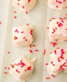Strawberry Cool Whip candy topped with red sprinkles before chilling.