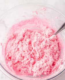 Strawberry Cool Whip candy mixture fully combined and fluffy in a bowl.