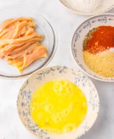 Breaded chicken strips prepared to make copycat Burger King chicken fries.