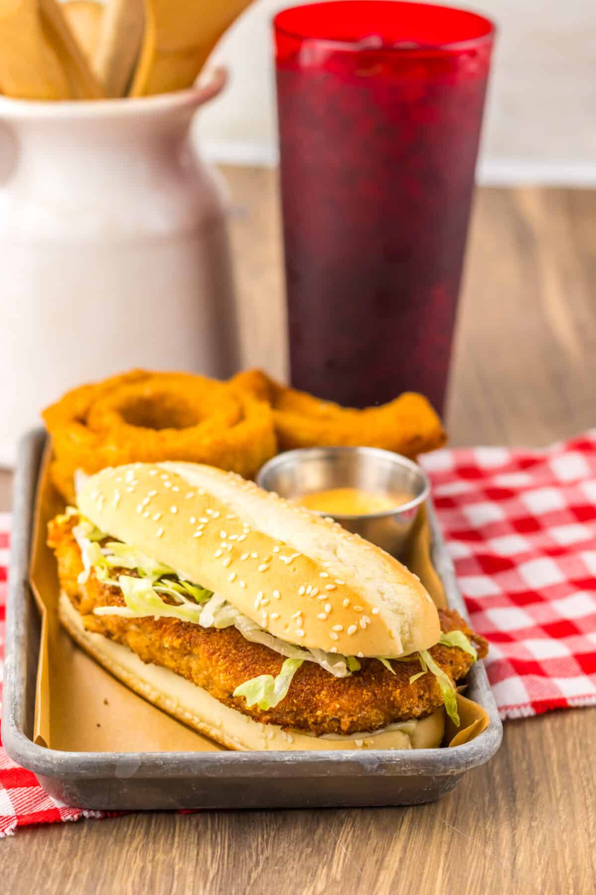 Crispy chicken patty on a bun with shredded lettuce and mayonnaise.