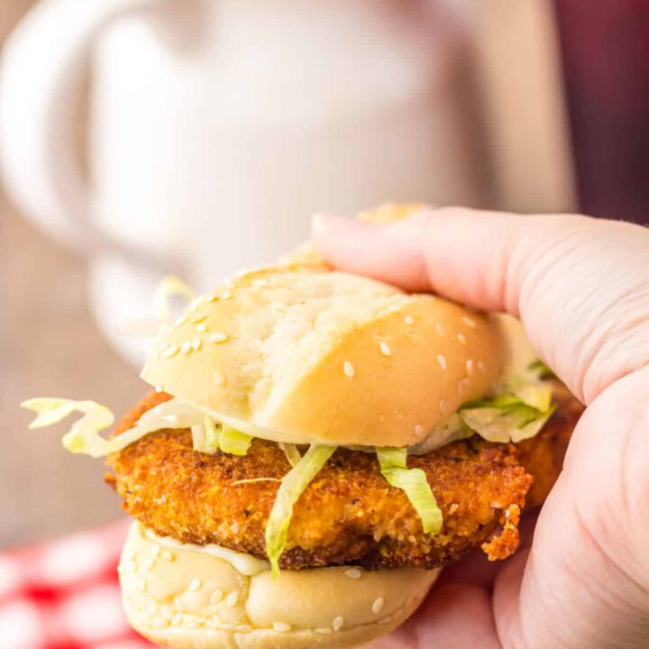 Hand holding a copycat Burger King chicken sandwich.