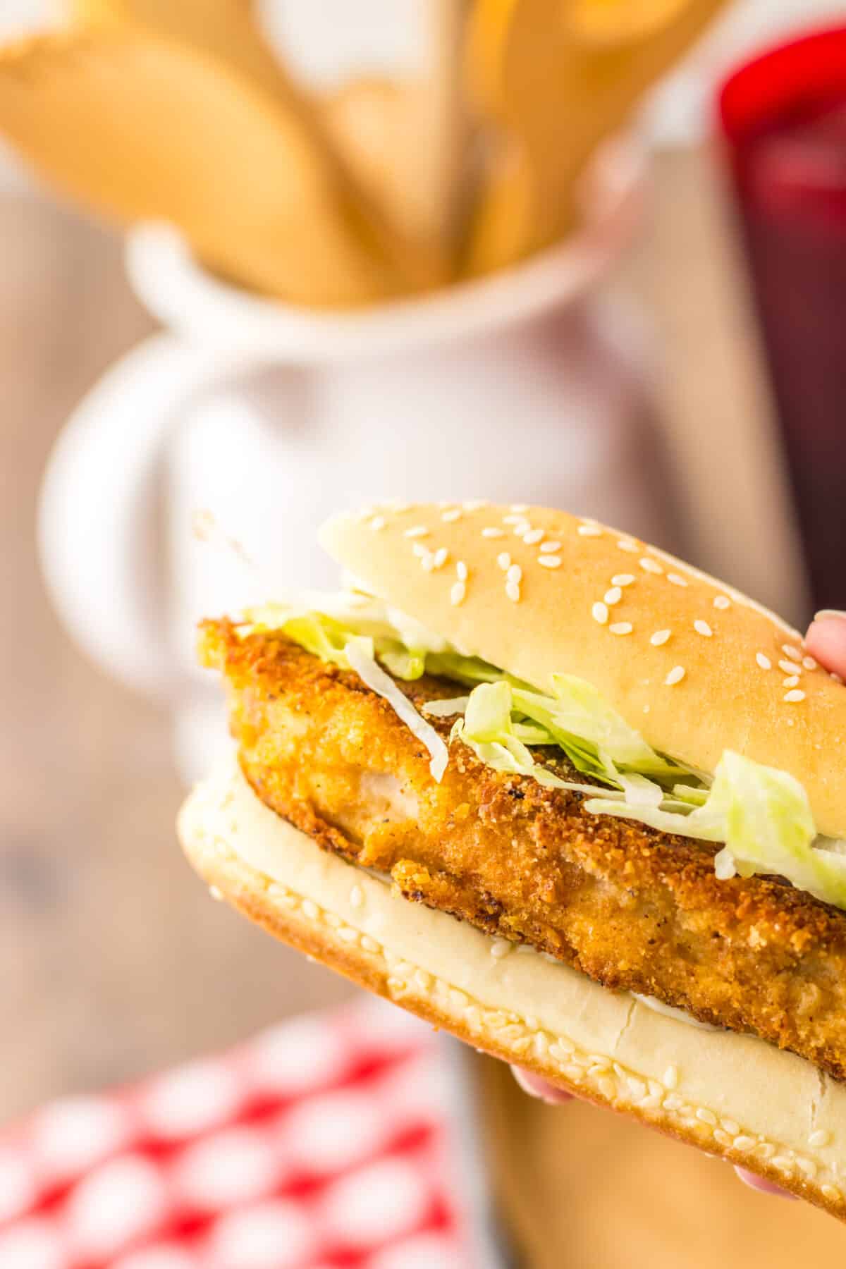 Hand holding a copycat Burger King chicken sandwich.