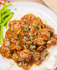 Tender slow cooker Coca Cola beef tips coated in a rich brown gravy.