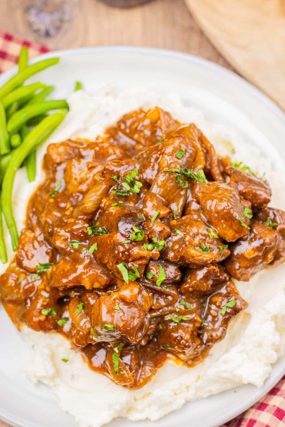 Tender slow cooker Coca Cola beef tips coated in a rich brown gravy.
