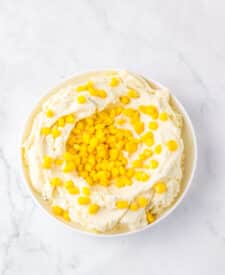 Mashed potatoes topped with sweet corn for homemade KFC Famous Bowls.