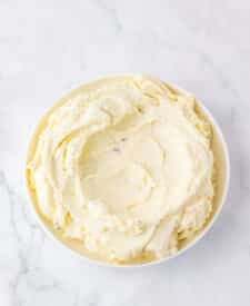 Creamy mashed potatoes spread in a serving bowl as the base layer.
