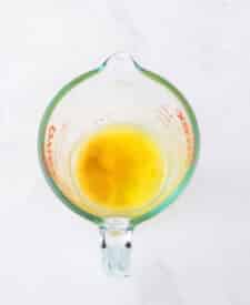 Garlic butter prepared for brushing over breadsticks.