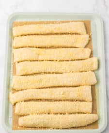 Melted butter mixture brushed onto Crazy Bread before baking.